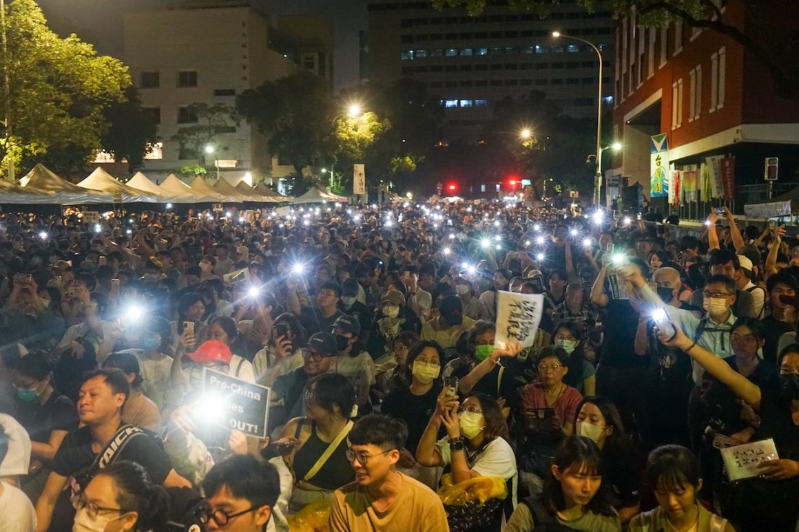 Protesters gather on Jinan Road in Taipei, south of the Legislative Yuan compound.